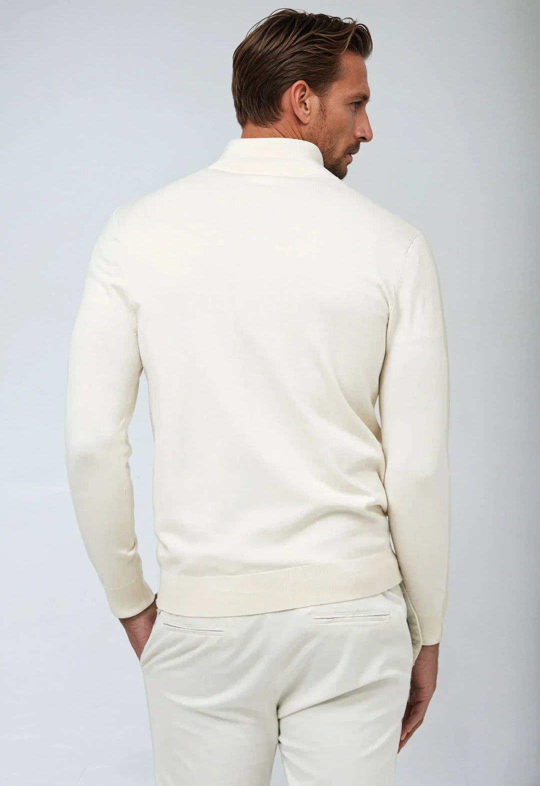 Close-up of men's half-zip pullover's collar and zipper, highlighting classic style.
