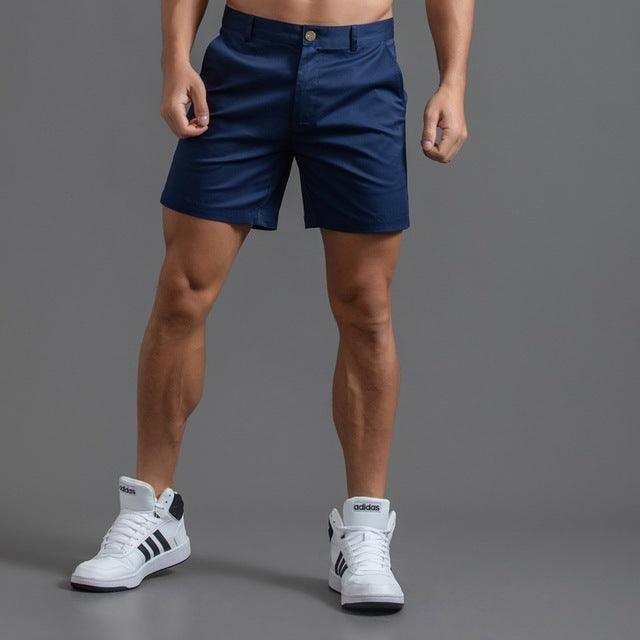 Close-up of men's chino shorts fabric, highlighting quality and comfortable fit for summer fashion.