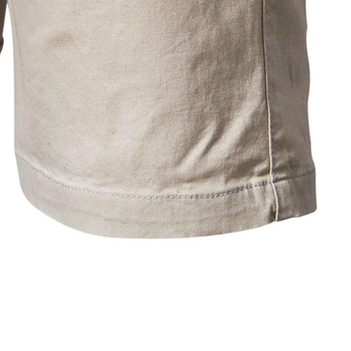 Close-up of belt loops on men's navy chino shorts, designed for comfortable summer wear.