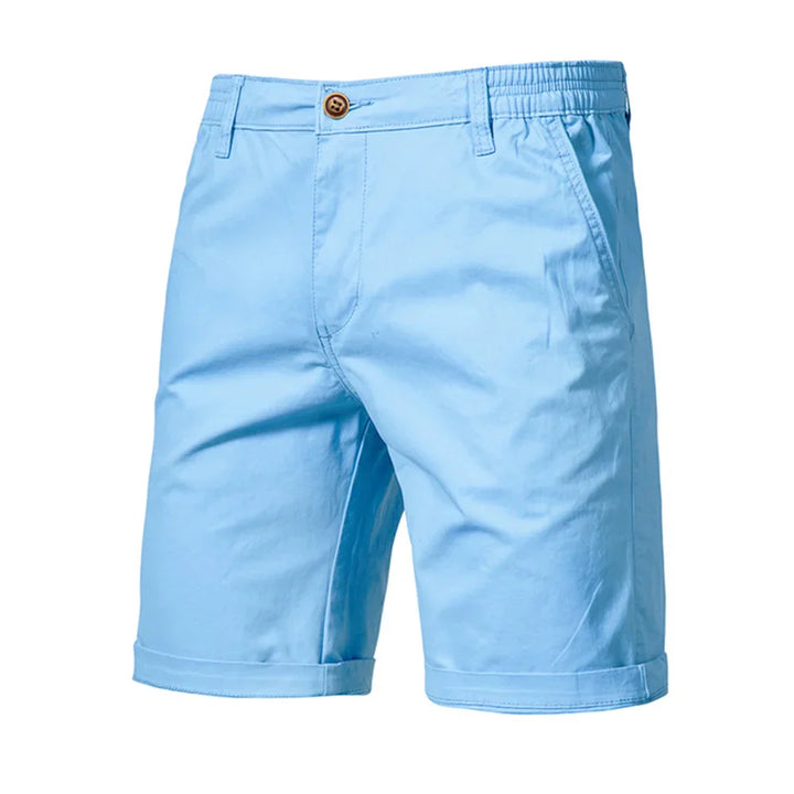 Crisp white men's chino shorts, offering a clean look for smart casual summer fashion.