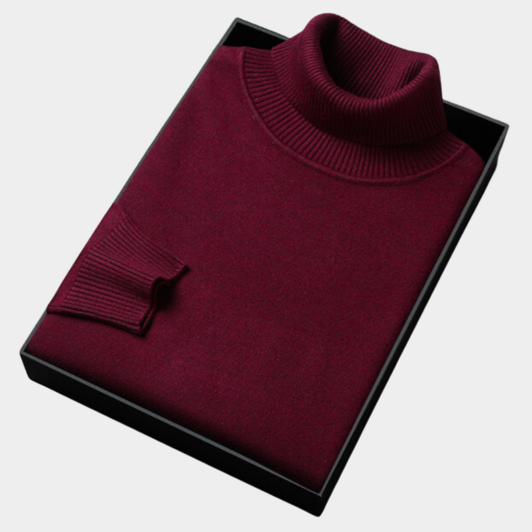 Detail of the long sleeve cuff on a men's solid turtleneck pullover sweater, designed for comfort.