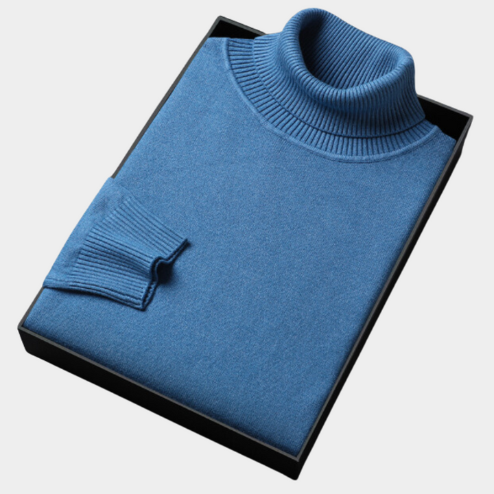 Stylish men's solid navy blue long-sleeve turtleneck sweater, a versatile pullover for spring fashion.
