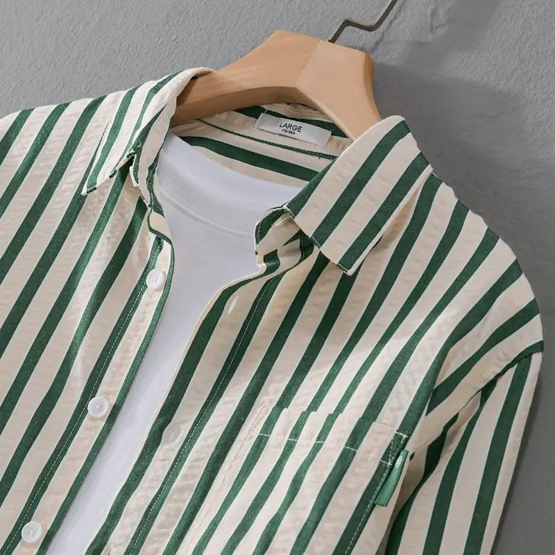 Stylish men's long-sleeve striped button-down shirt, a versatile classic for casual, work, and dress shirt outfits.