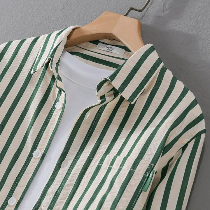 Stylish men's long-sleeve striped button-down shirt, a versatile classic for casual, work, and dress shirt outfits.
