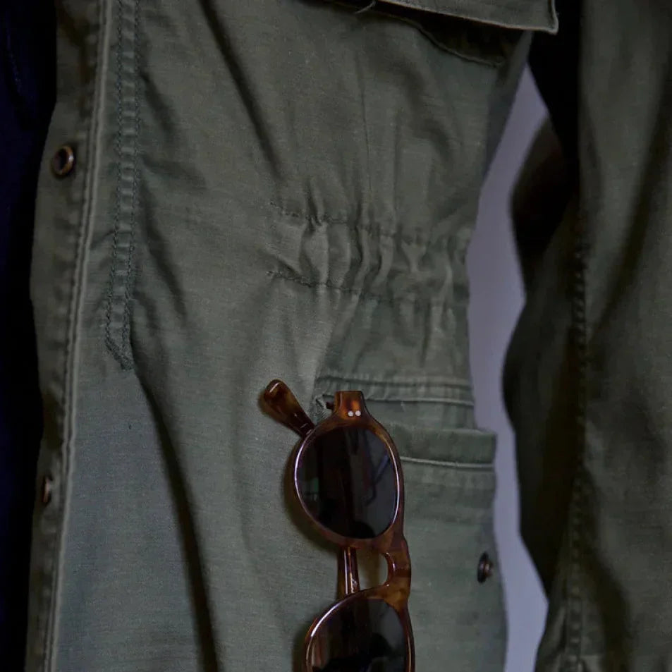 Adventure-ready men's vintage field jacket, classic outerwear with an adjustable waist for comfort.