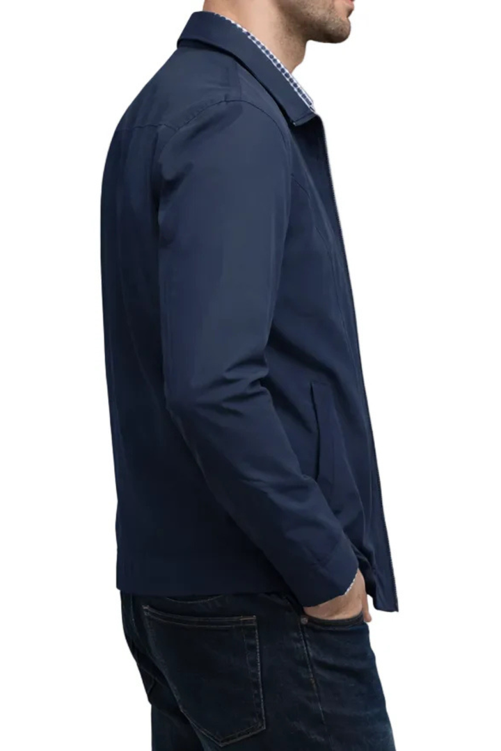 Classic men's collared Harrington jacket featuring a distinctive check lining. Durable men's outerwear, everyday style.