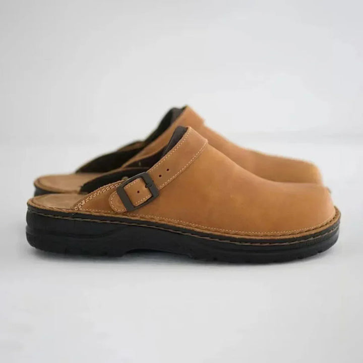 Men's comfort clogs with an adjustable buckle strap, perfect for indoor & outdoor wear. Slip-on casual footwear.