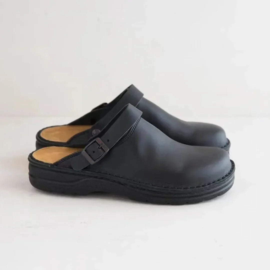 Versatile men's slip-on comfort clogs featuring an adjustable buckle for a custom fit. Ideal casual footwear.
