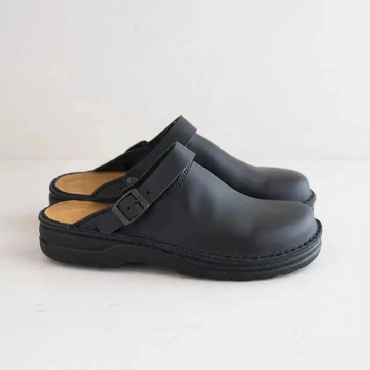 Versatile men's slip-on comfort clogs featuring an adjustable buckle for a custom fit. Ideal casual footwear.