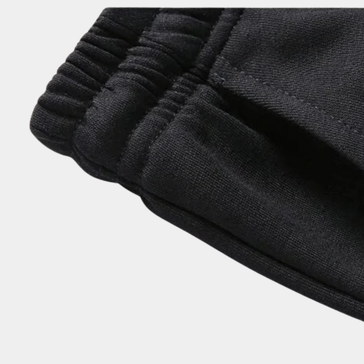 Modern men's tracksuit set for casual outings, featuring a comfortable hoodie & matching joggers. Autumn fashion.