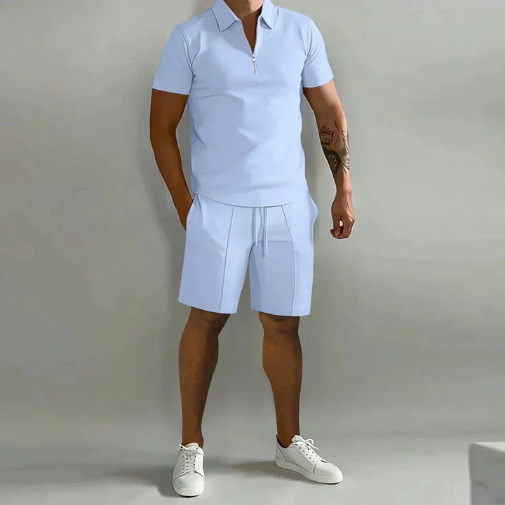 Stylish men's two-piece zip polo shirt & shorts set. Versatile for casual outings and relaxed wear.