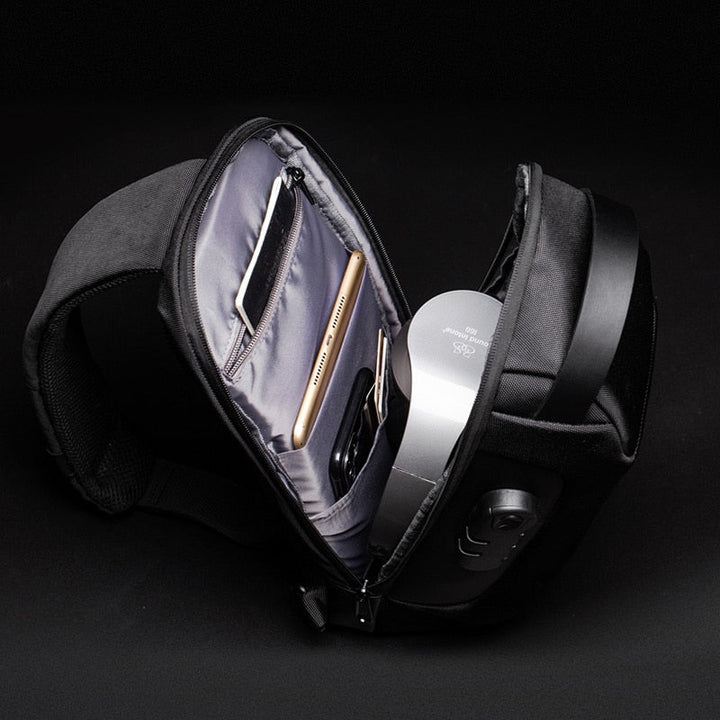 Modern men's compact anti-theft travel bag, ideal for urban commutes, with convenient USB charging.
