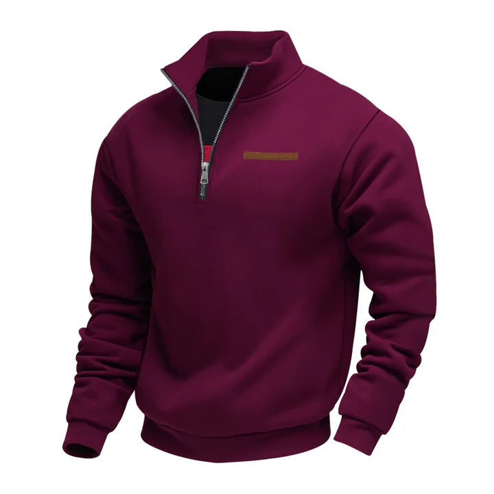 Folded men's red fleece pullover sweatshirt, highlighting its soft material