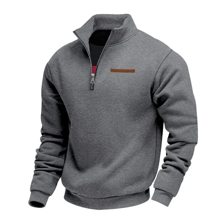 Model from behind wearing a men's navy fleece pullover sweatshirt, showing fit