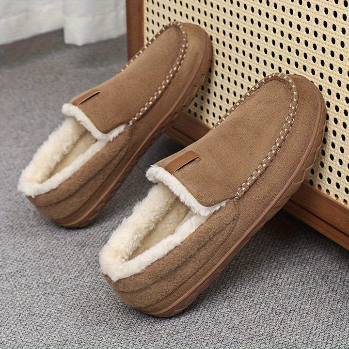 Warm men's slip-on house shoes, ideal for winter relaxation, featuring a comfort design.