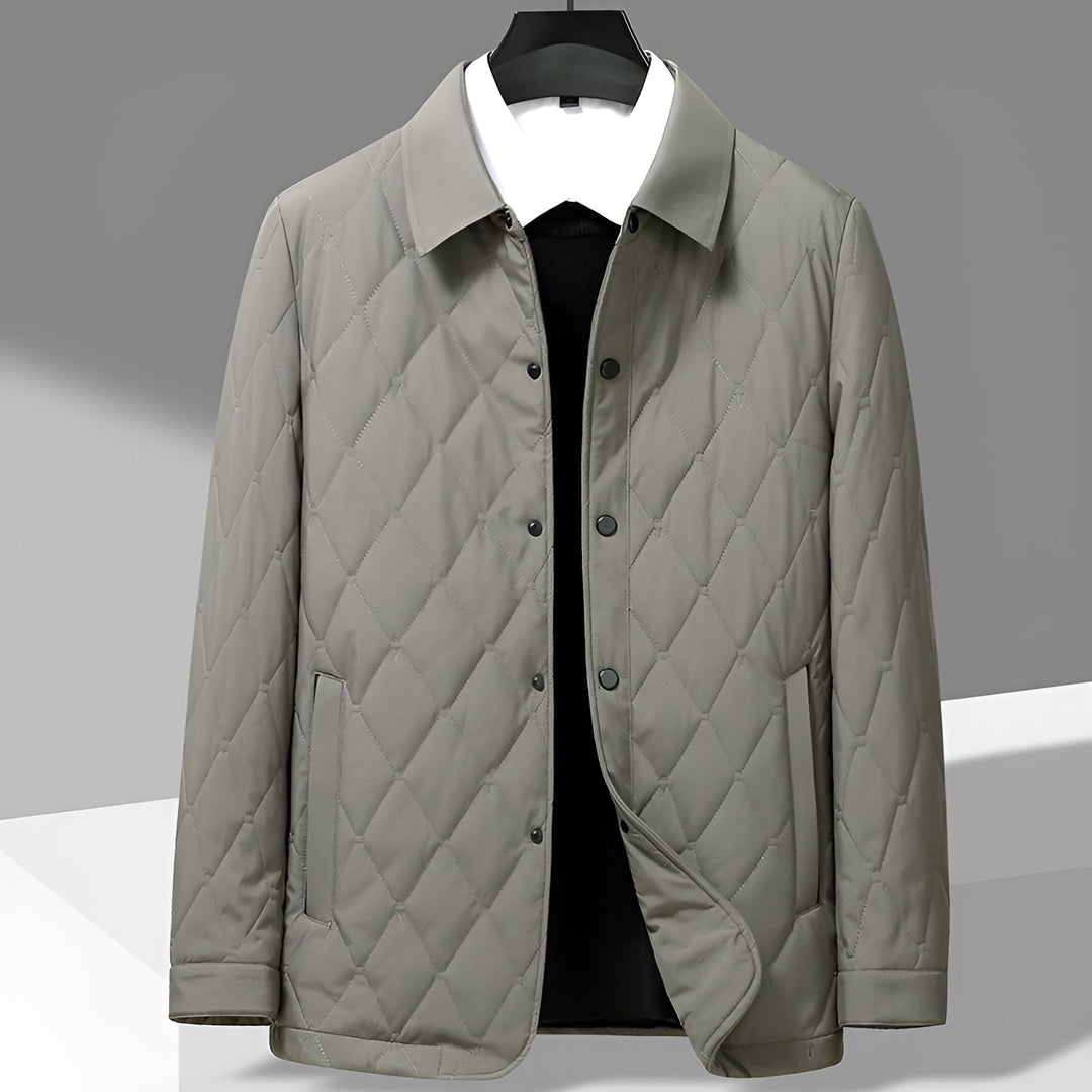 Stylish men's quilted jacket featuring a sharp shirt collar & smart design. Versatile for casual & formal looks.