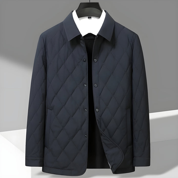 Modern men's jacket with a diamond quilted finish, practical utility pockets, and a stylish shirt collar for versatility.