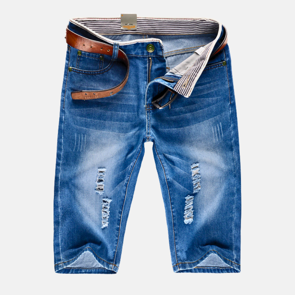 Men's distressed ripped streetwear shorts, rugged & stylish for casual urban summer fashion.