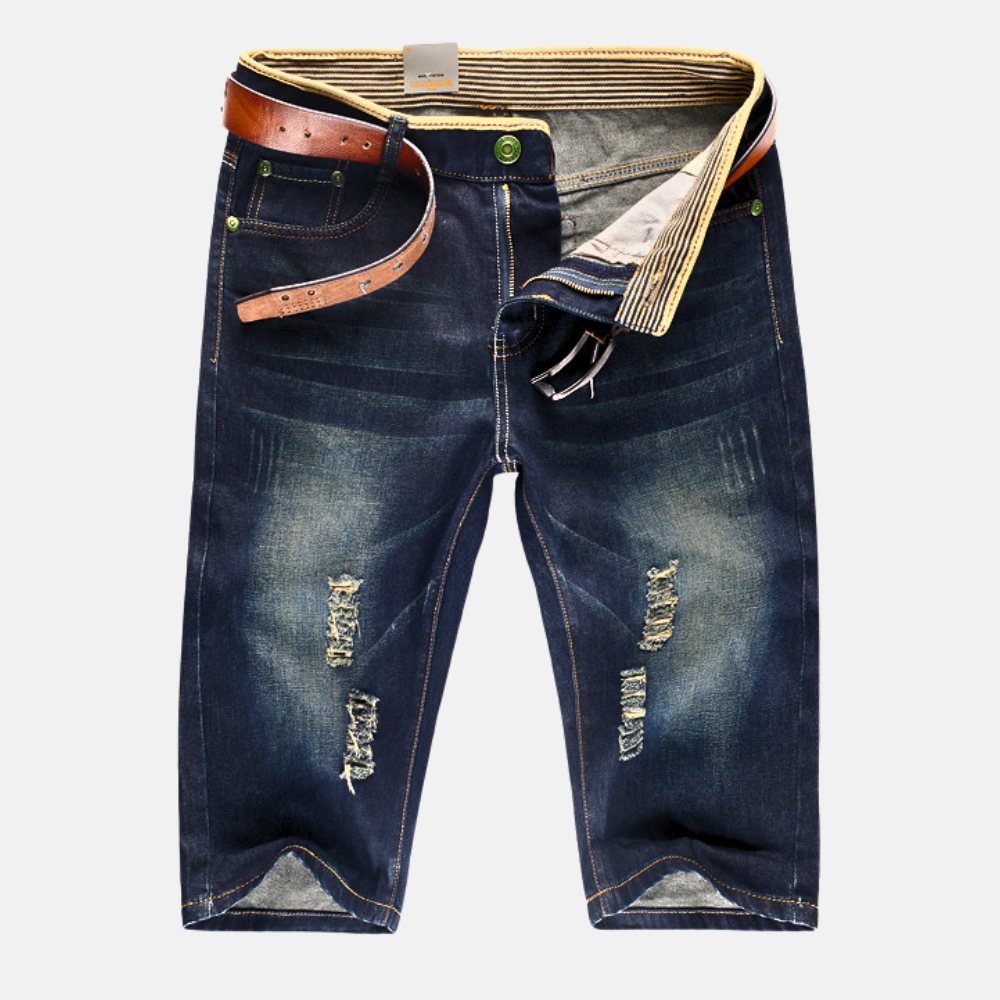 Relaxed fit men's distressed ripped shorts, perfect knee-length streetwear for warm weather & everyday style.