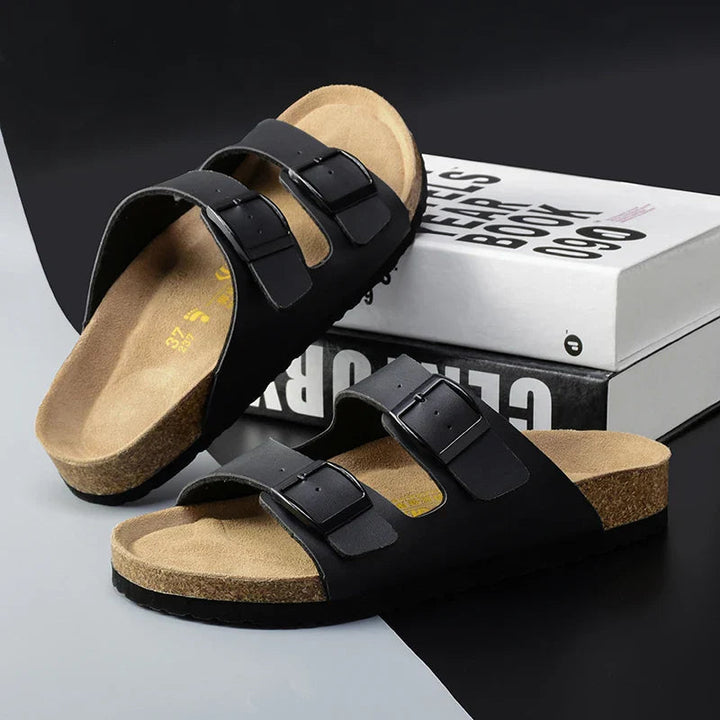Men's double buckle cork footbed sandals for casual summer wear. Comfortable and adjustable slip-on slides.