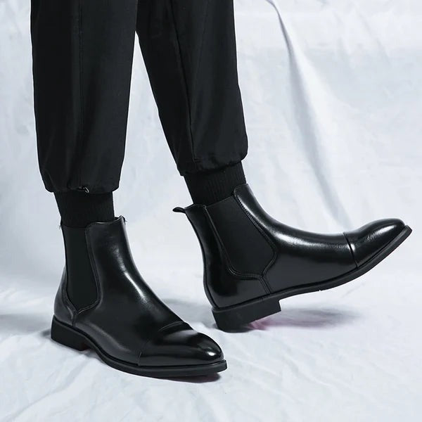 Side view of men's stylish black ankle boots. Durable, comfortable smart casual footwear for everyday wear.