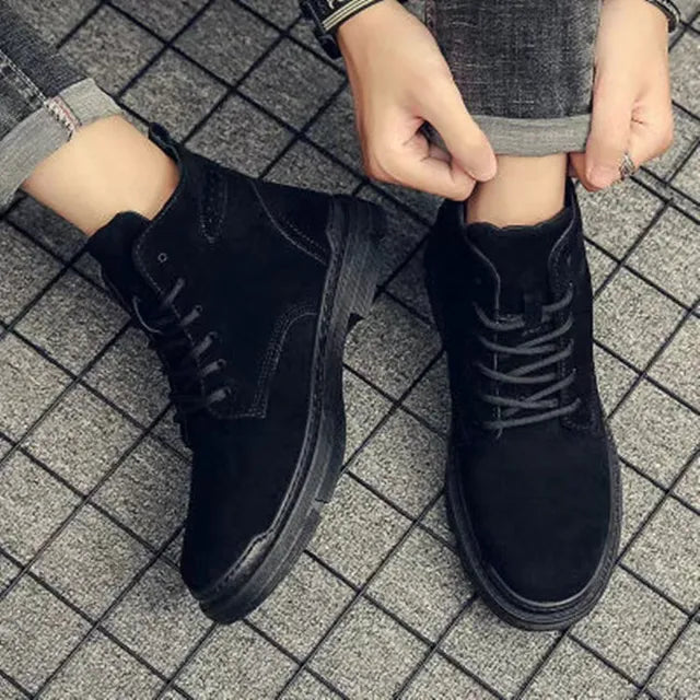 Close-up of men's black hiking boots, showcasing robust construction for outdoor footwear