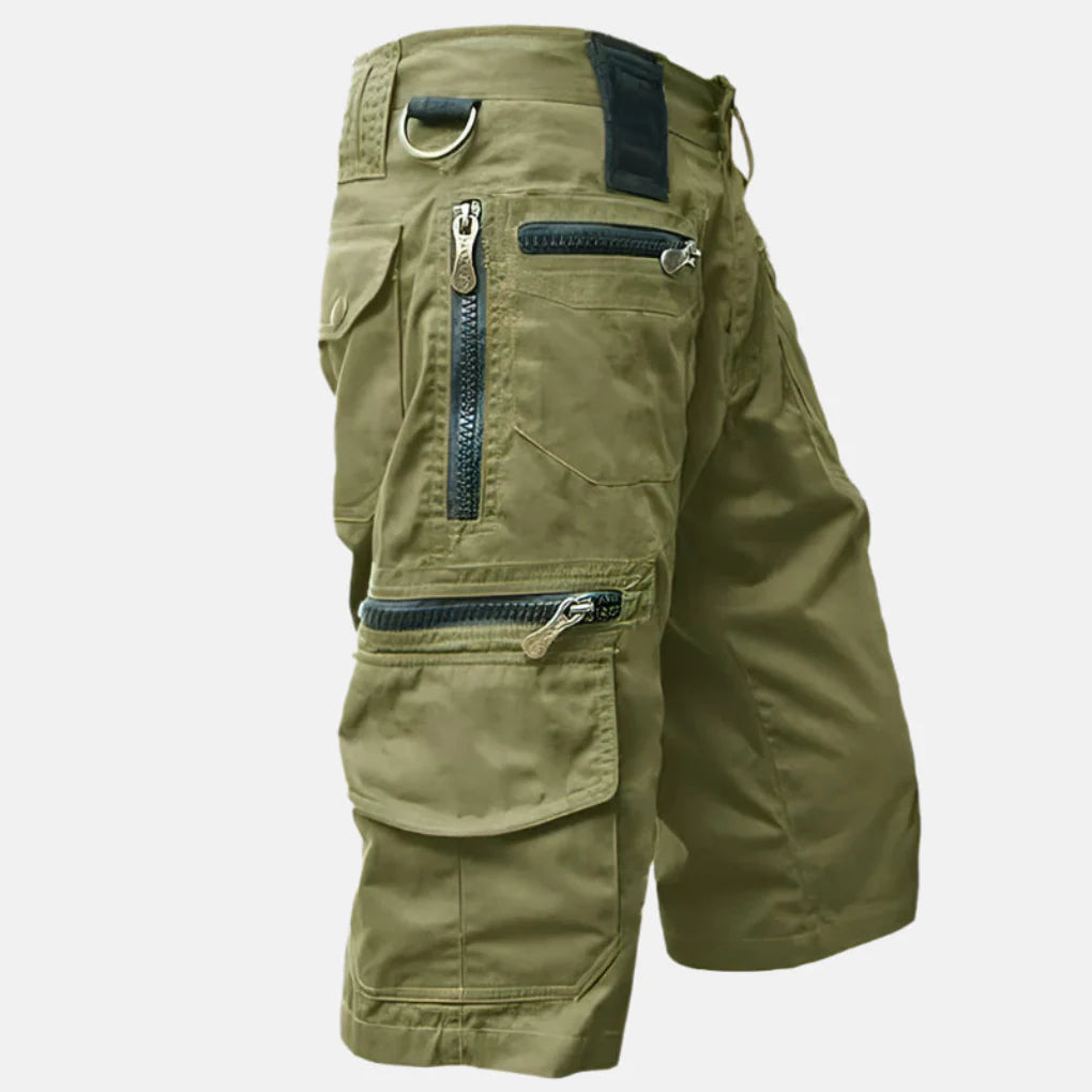 Close-up of the rugged fabric and secure button closure on men's multi-pocket cargo shorts, built for activity.