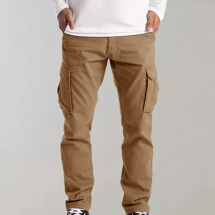 Close-up of men's tactical pants waistband and front button closure with belt loops