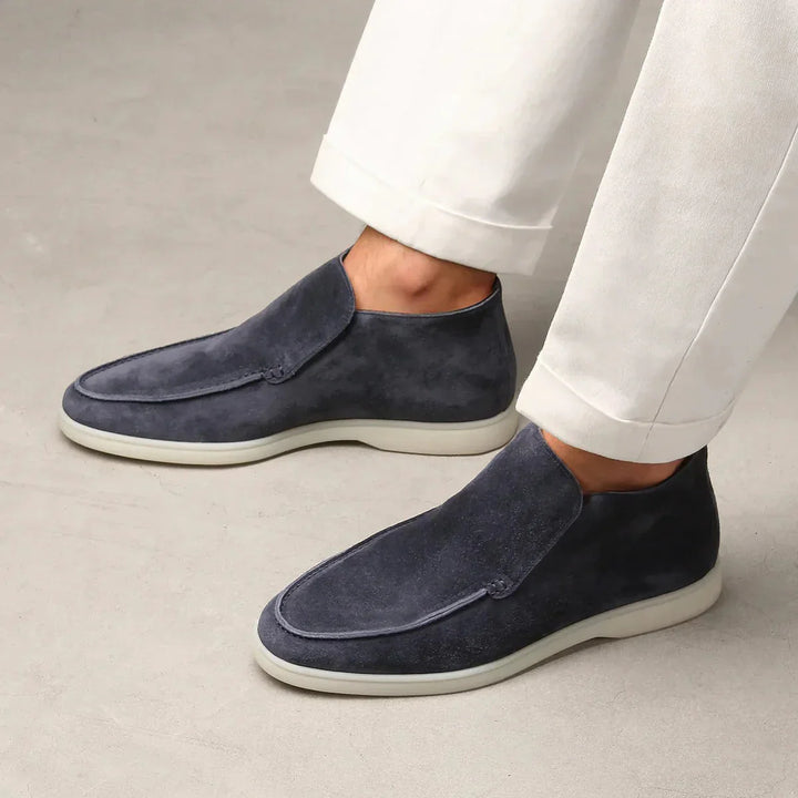 Comfortable men's moc toe slip-on shoes with minimalist design for easy wear.