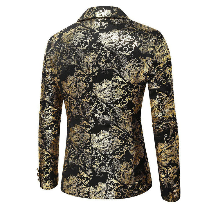Detailed view of men's black blazer fabric showcasing the intricate elegant gold pattern design.