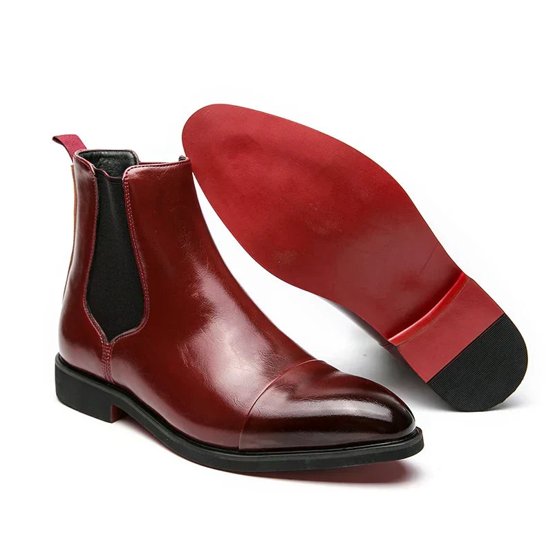 Stylish men's brown leather slip-on dress boots with a sleek design, perfect for any outfit.