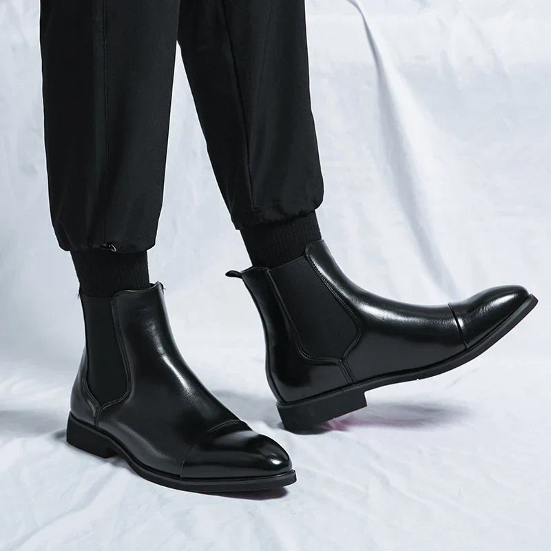 Pair of versatile men's slip-on leather boots, ideal footwear for both formal and casual mens fashion.