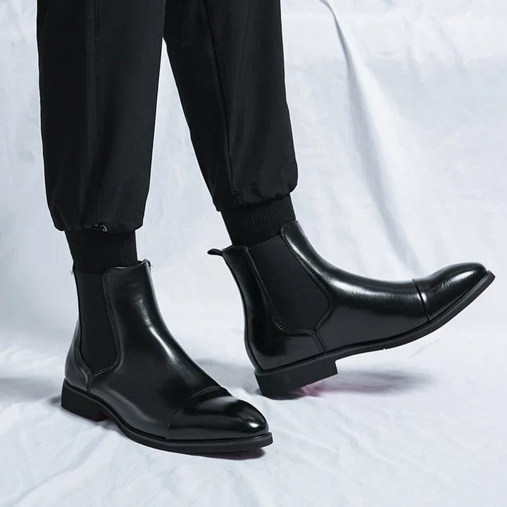 Pair of versatile men's slip-on leather boots, ideal footwear for both formal and casual mens fashion.