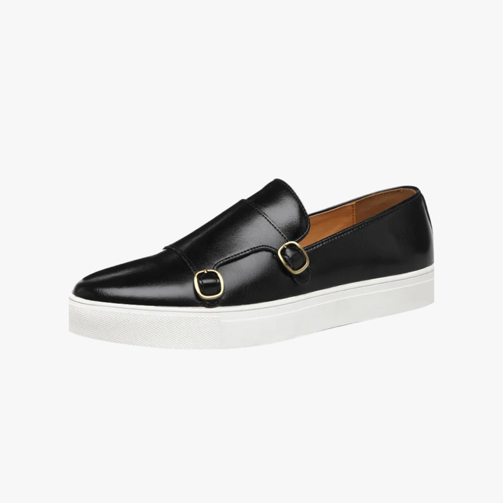 Modern black slip-on loafers for men with stylish metal buckle detail. Versatile formal and casual footwear.