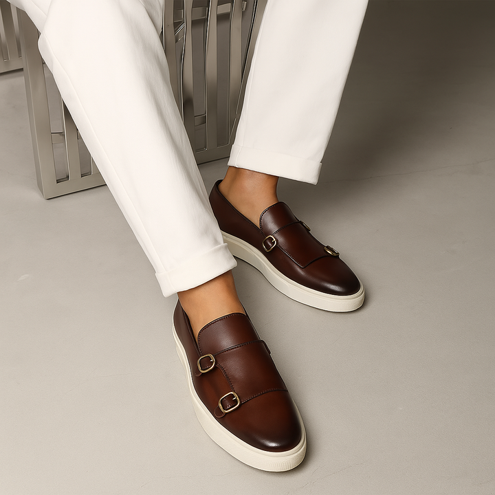 Classic men's buckle loafers in rich brown, perfect for a sophisticated look. Elegant slip-on shoes for office or events.