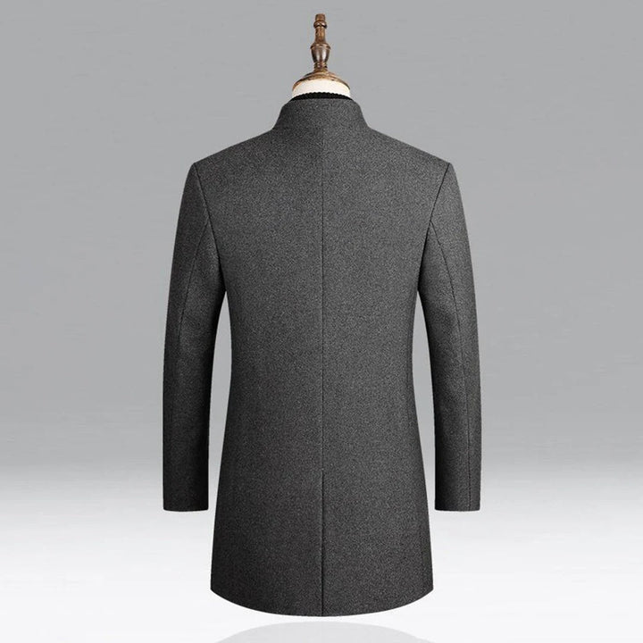 Men's elegant formal overcoat paired with a scarf, demonstrating timeless winter style for business outerwear.