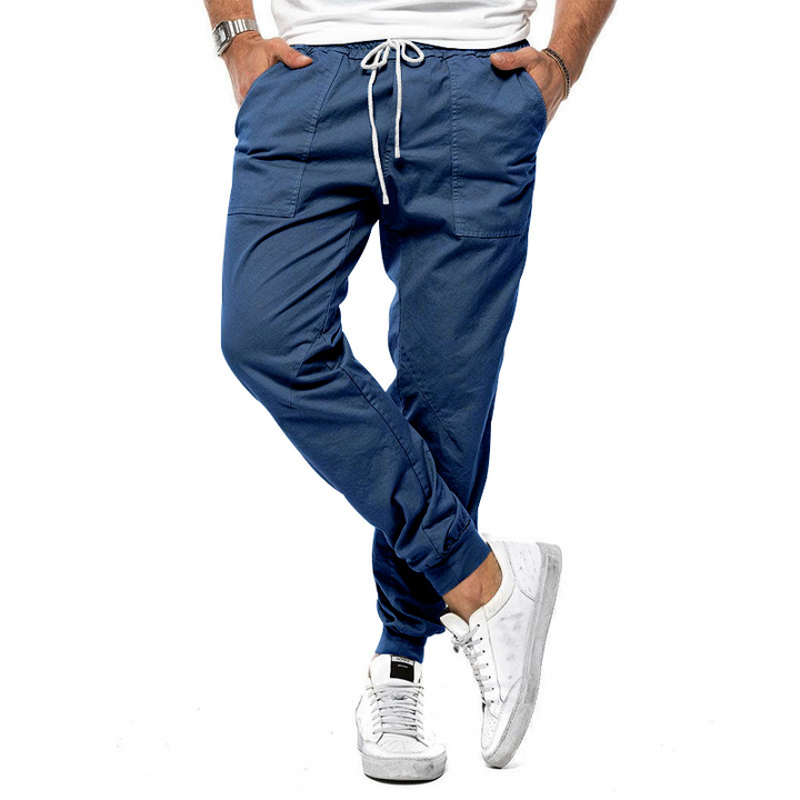 Stylish men's green chino trousers. Elegant design and comfortable fit for modern men's fashion.