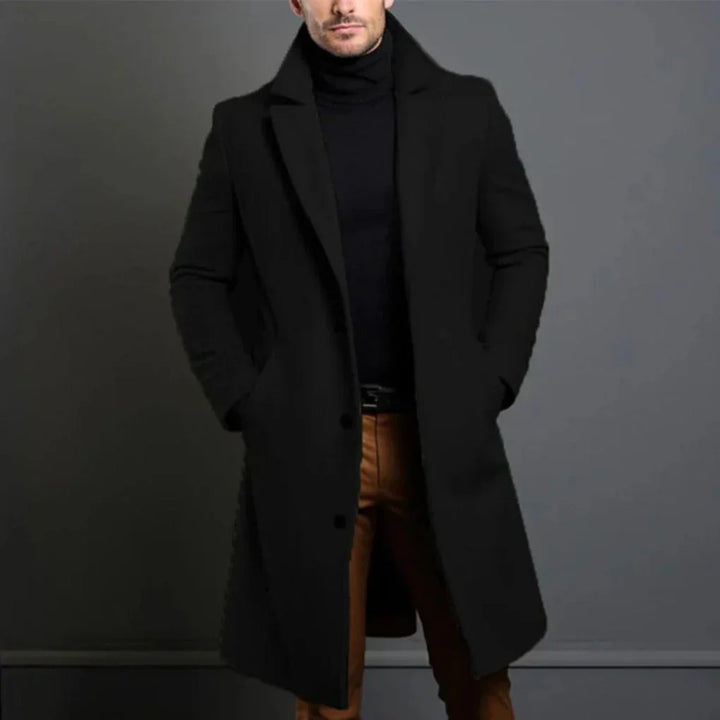Men's elegant longline overcoat in a classic color, perfect for sophisticated cool weather business attire.