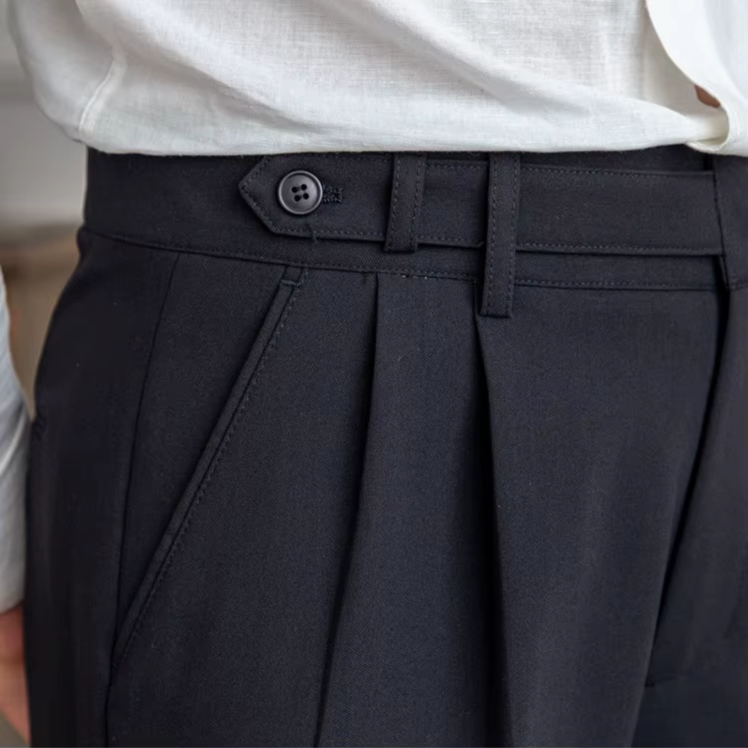 Black men's tailored pleated trousers, designed for an elegant and professional business look.