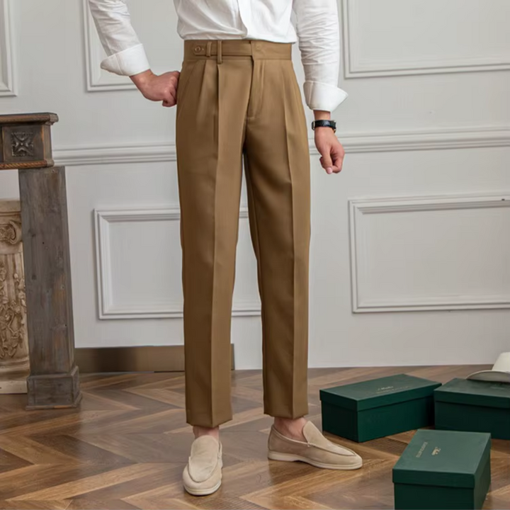 Men's business casual beige pleated chinos, combining comfort with classic tailored style.