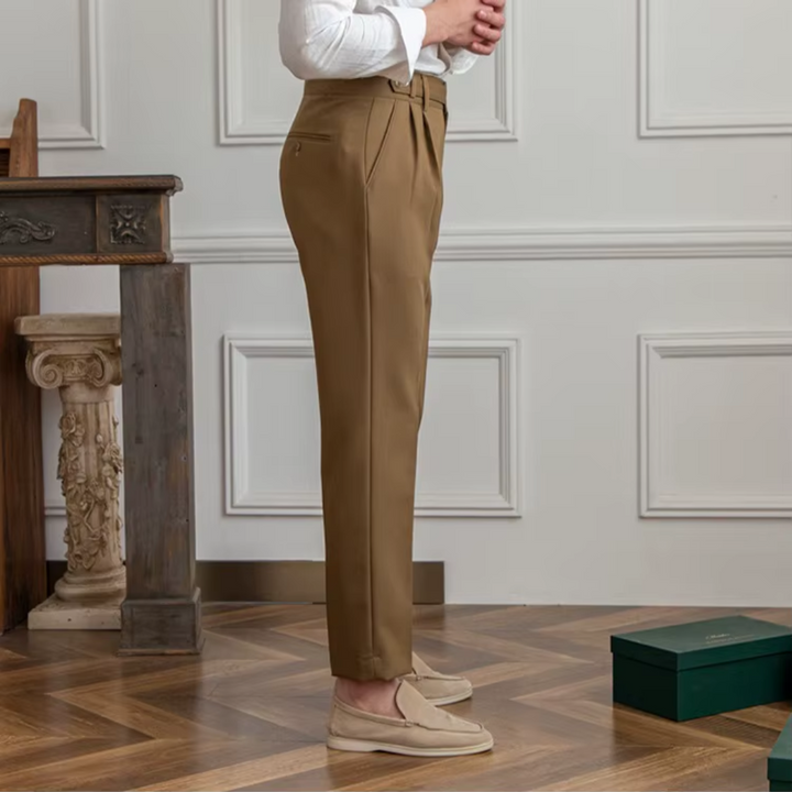 Tailored black men's pleated trousers, an essential for a sophisticated business wardrobe.