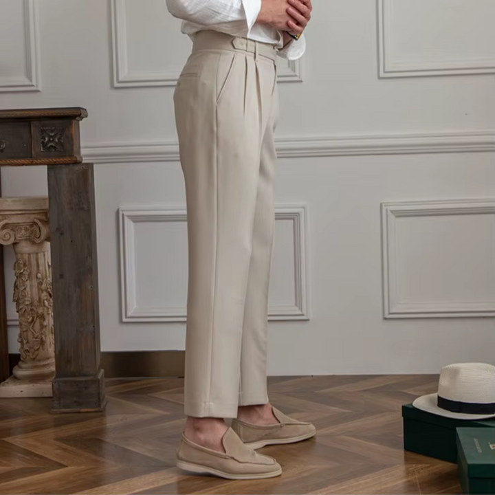 Beige men's pleated chino pants, classic tailored fit for business or smart casual fashion.
