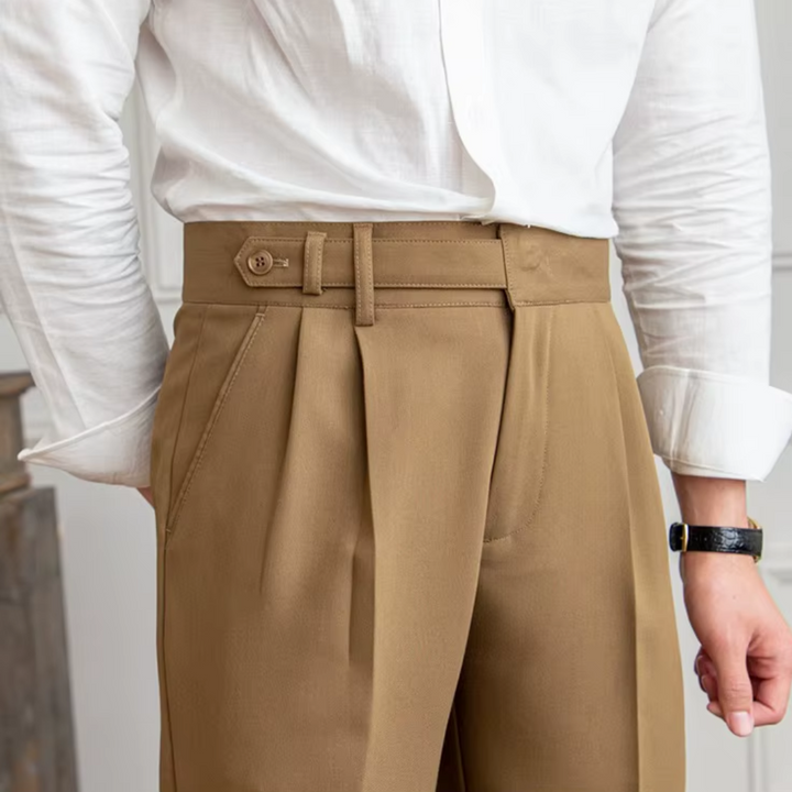 Camel pleated men's chino pants, offering a refined look for both work and leisure.