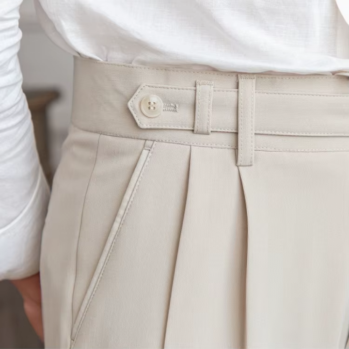 Stylish men's beige pleated trousers, a tailored fit for comfortable business casual attire.