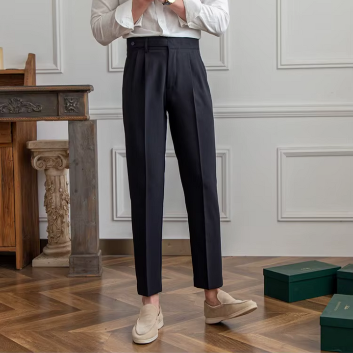 Elegant men's camel trousers, pleated and tailored, embodying classic men's fashion.