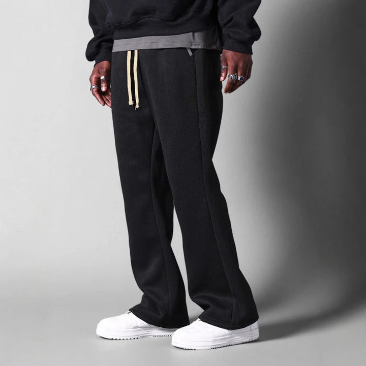 Stylish men's flared sweatpants, versatile casual pants for athleisure, sport, or comfortable fashion.