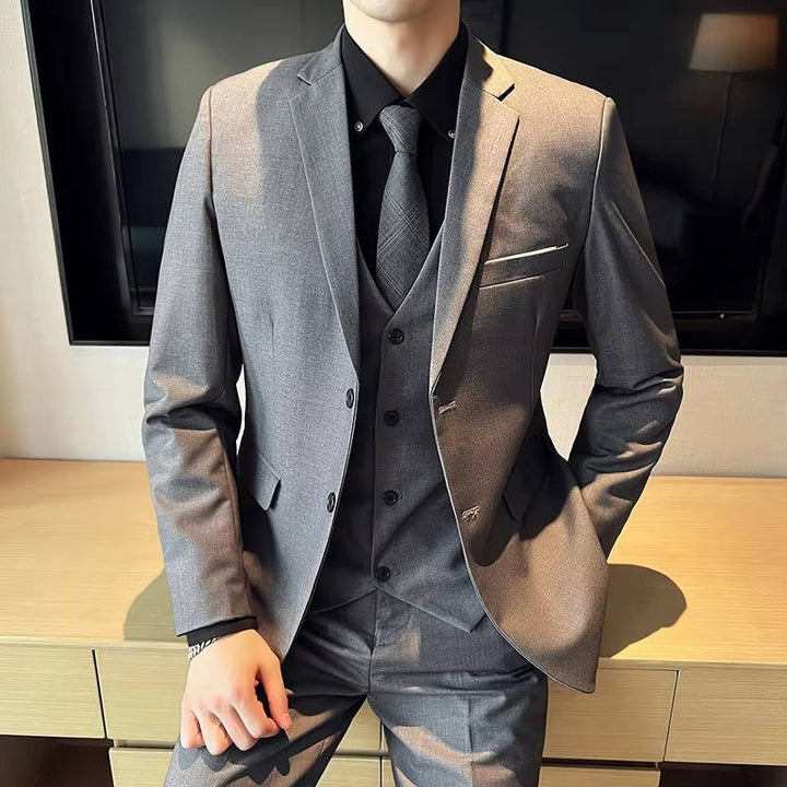 Men's formal three-piece suit with notch lapel, perfect for business attire & wedding fashion.