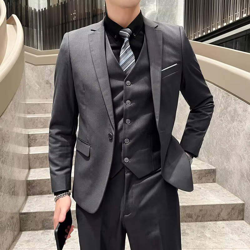 Men's sharp formal suit, three-piece and notch lapel. Ideal for office, business & occasions.