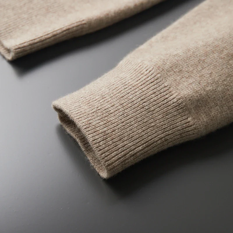Comfortable men's full zip sweater featuring a collared neck and convenient pockets.
