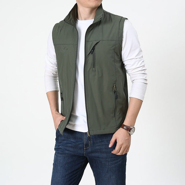 Stylish men's lightweight outdoor vest, featuring a full zip front and stand collar for active comfort.